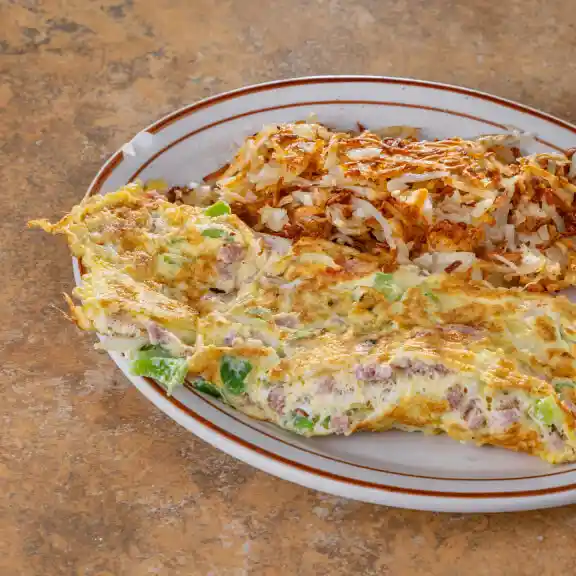 Loaded vegetable omelette served with hash browns