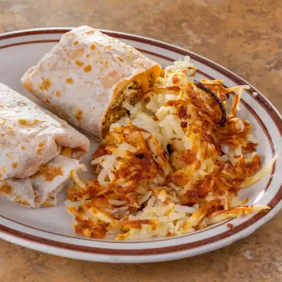 Breakfast burritos served with a side of golden hash browns
